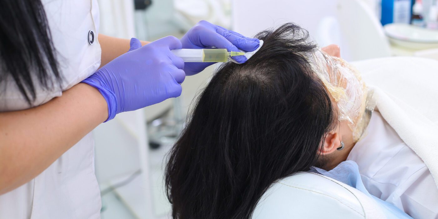 Researcher performs blood centrifuging