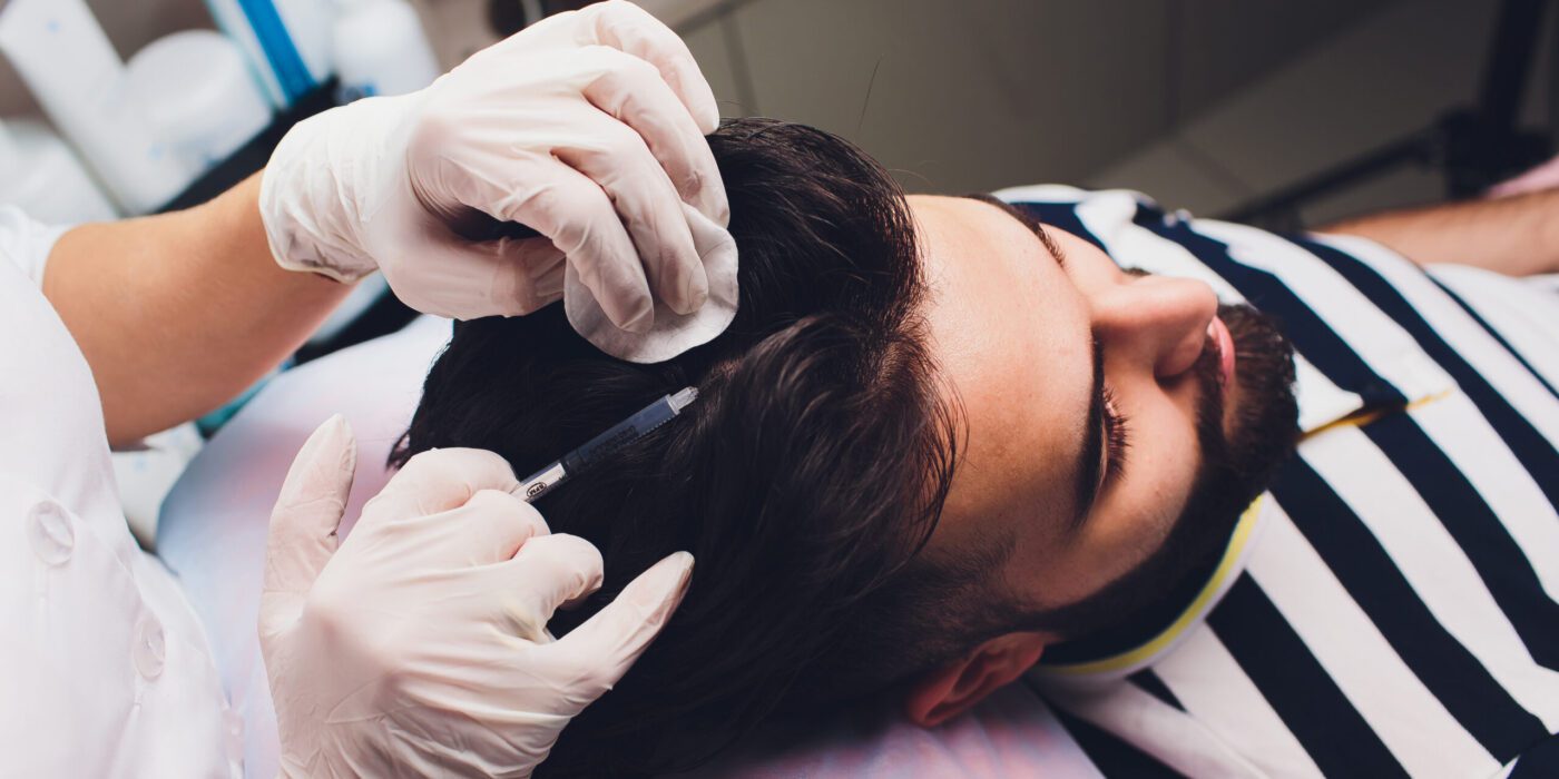 Treatment of baldness with beauty injections. Mesotherapy. Plasma lifting.